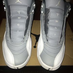 Air Jordan 12 retro white and grey have the shoe strings also 9.5